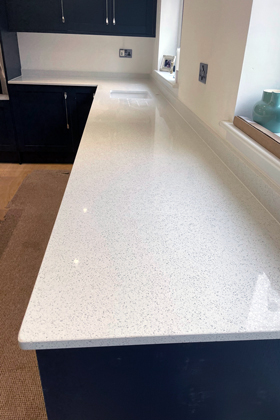 white speckled quartz counter top in modern kitchen interior